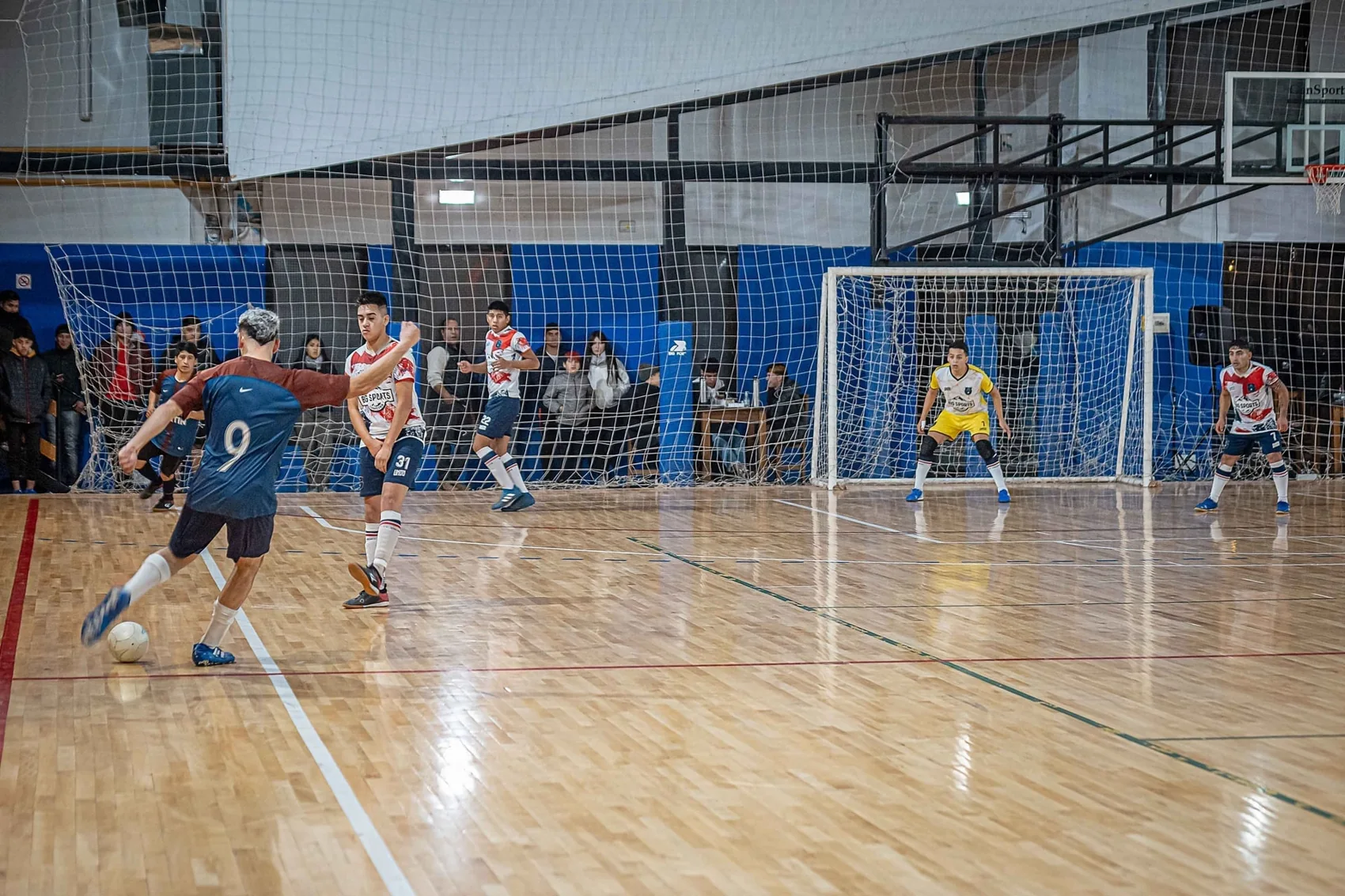 A futsal match at the Big Sports parquet court in El Bolsón